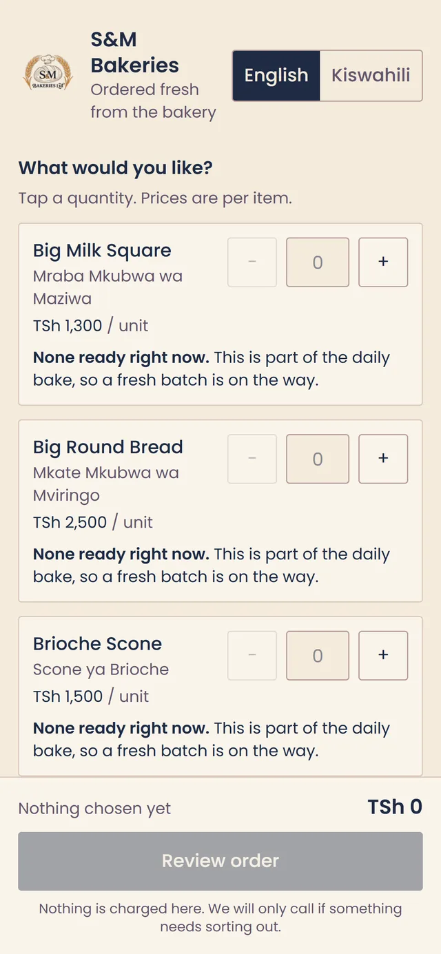 S&M Bakeries ordering app on a phone: the menu in English, each bread with its Kiswahili name, price per unit, quantity buttons and whether a batch is ready, above the running total and a review order button